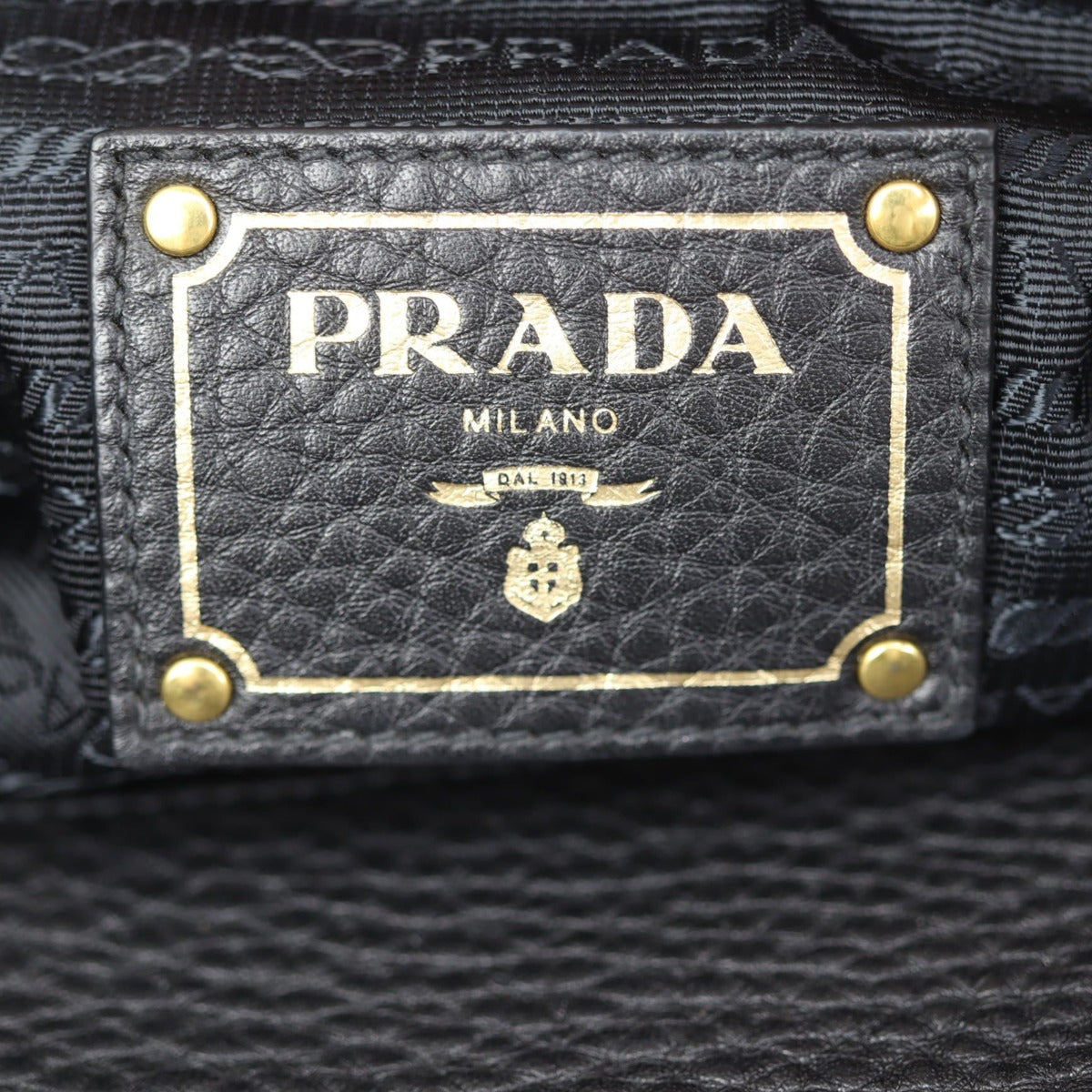Prada Vitello Daino Logo Embossed Tote Stamp
