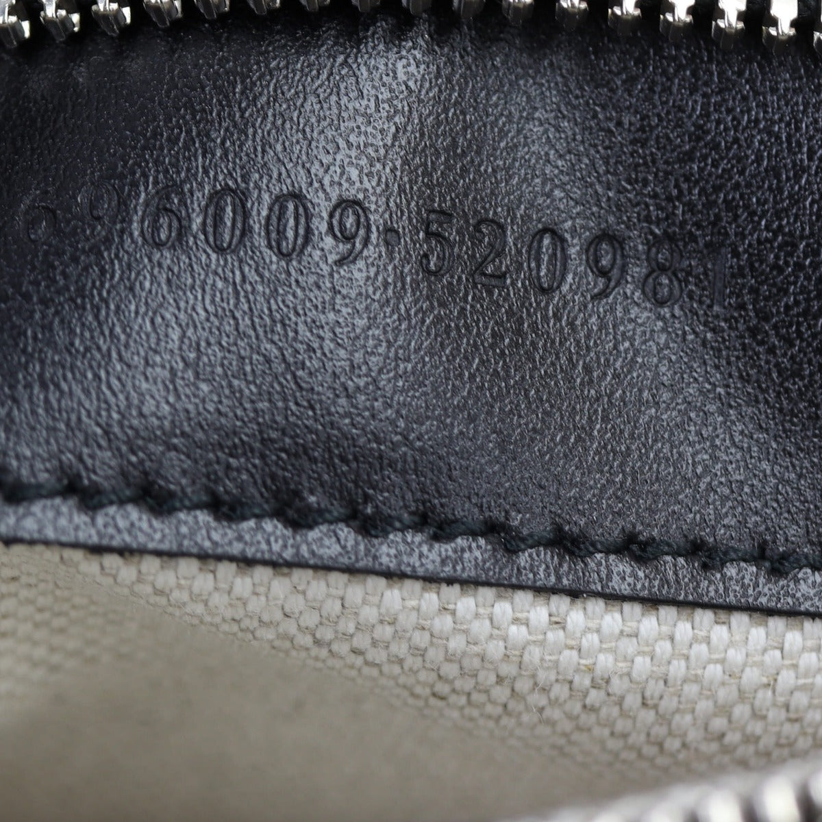 Gucci GG Embossed Messenger Bag