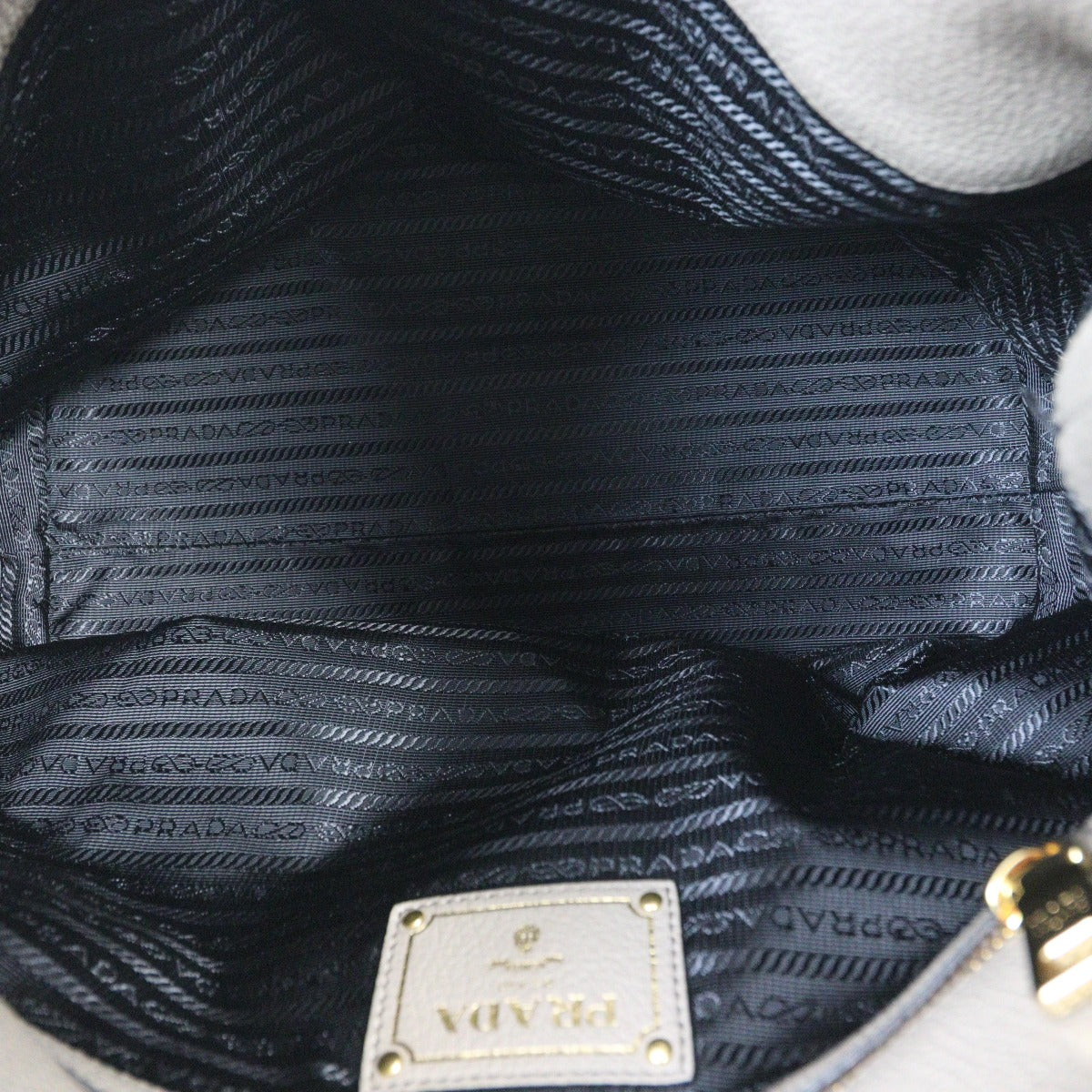 Prada Vitello Daino Logo Embossed Shoulder Bag